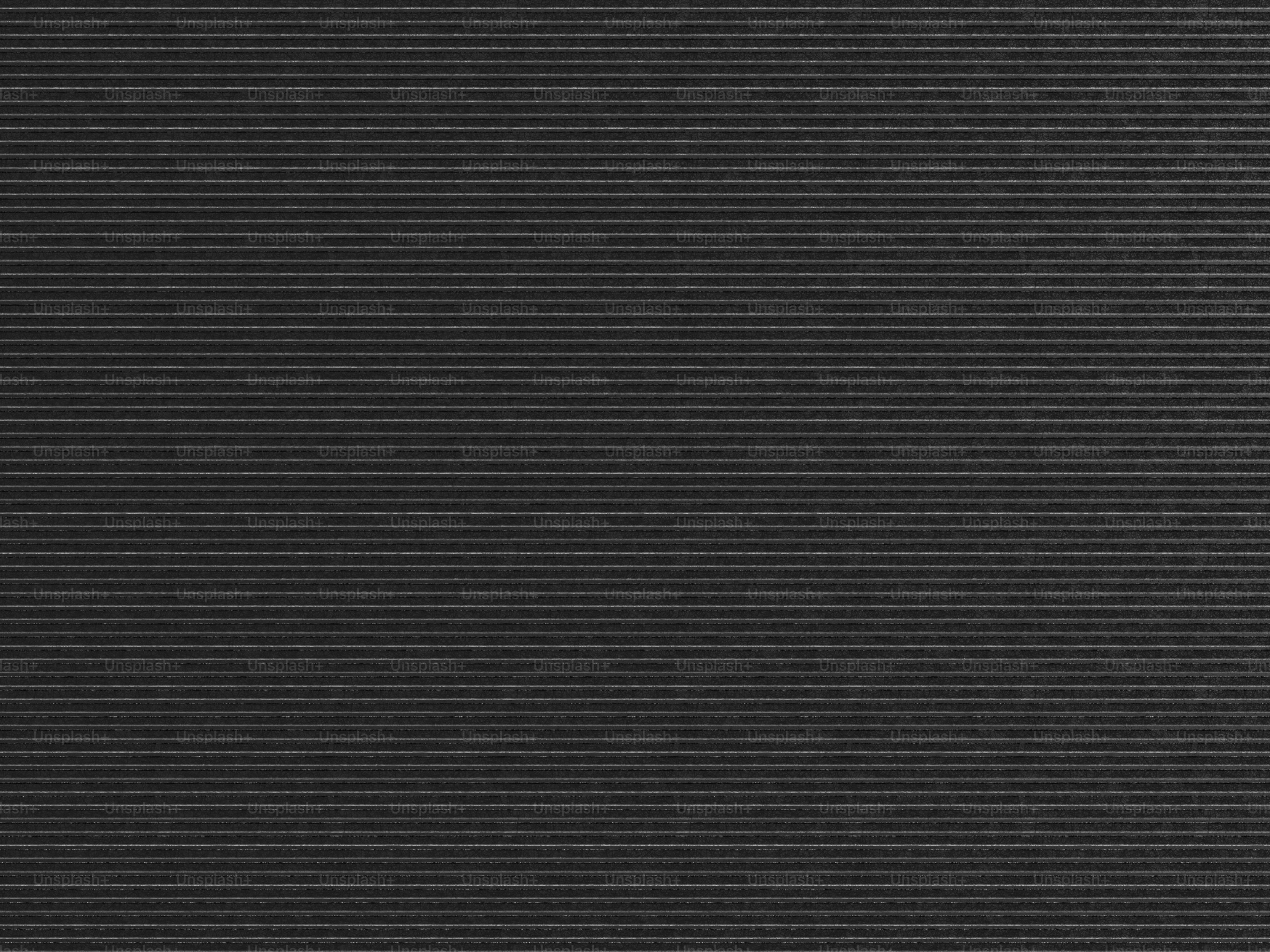 a close up of a black textured background