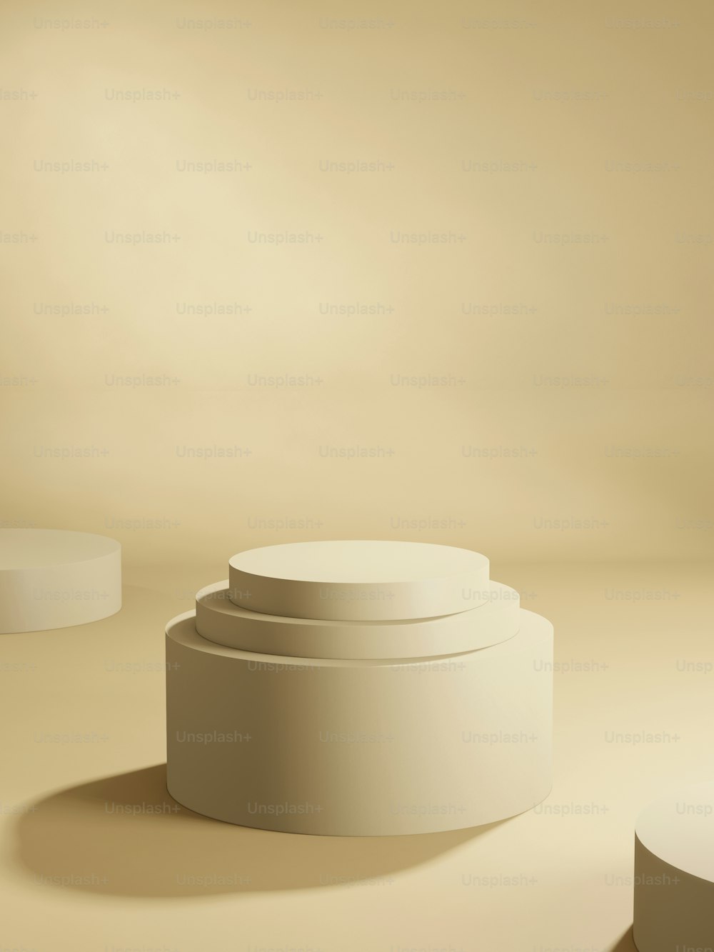 a group of three white pedestals sitting next to each other