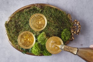 a basket filled with two glasses filled with liquid