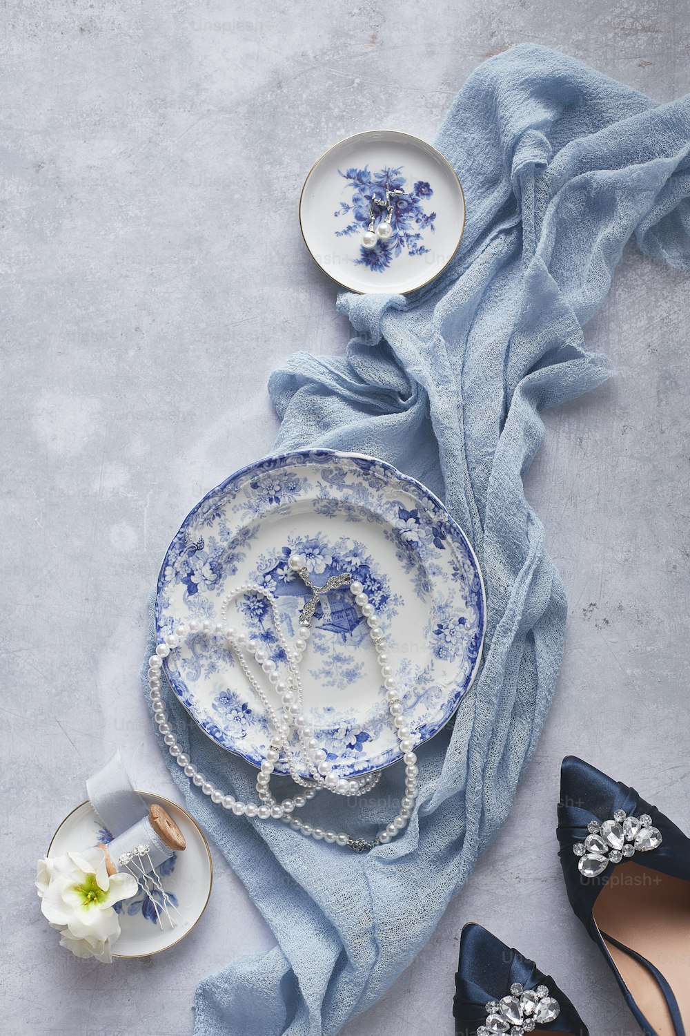 a table topped with blue and white dishes