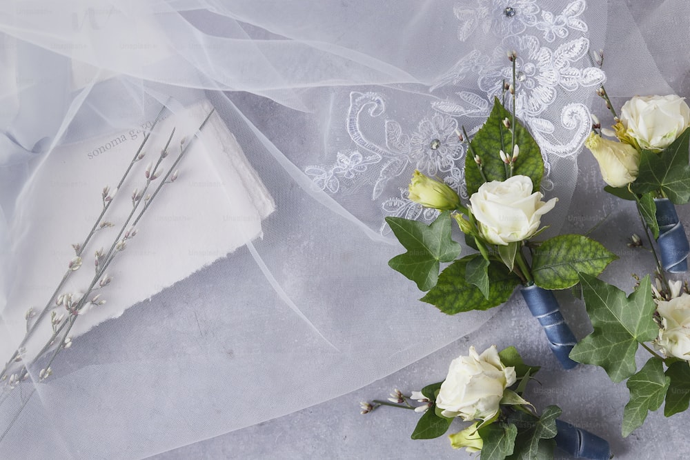 a bouquet of white roses on a table