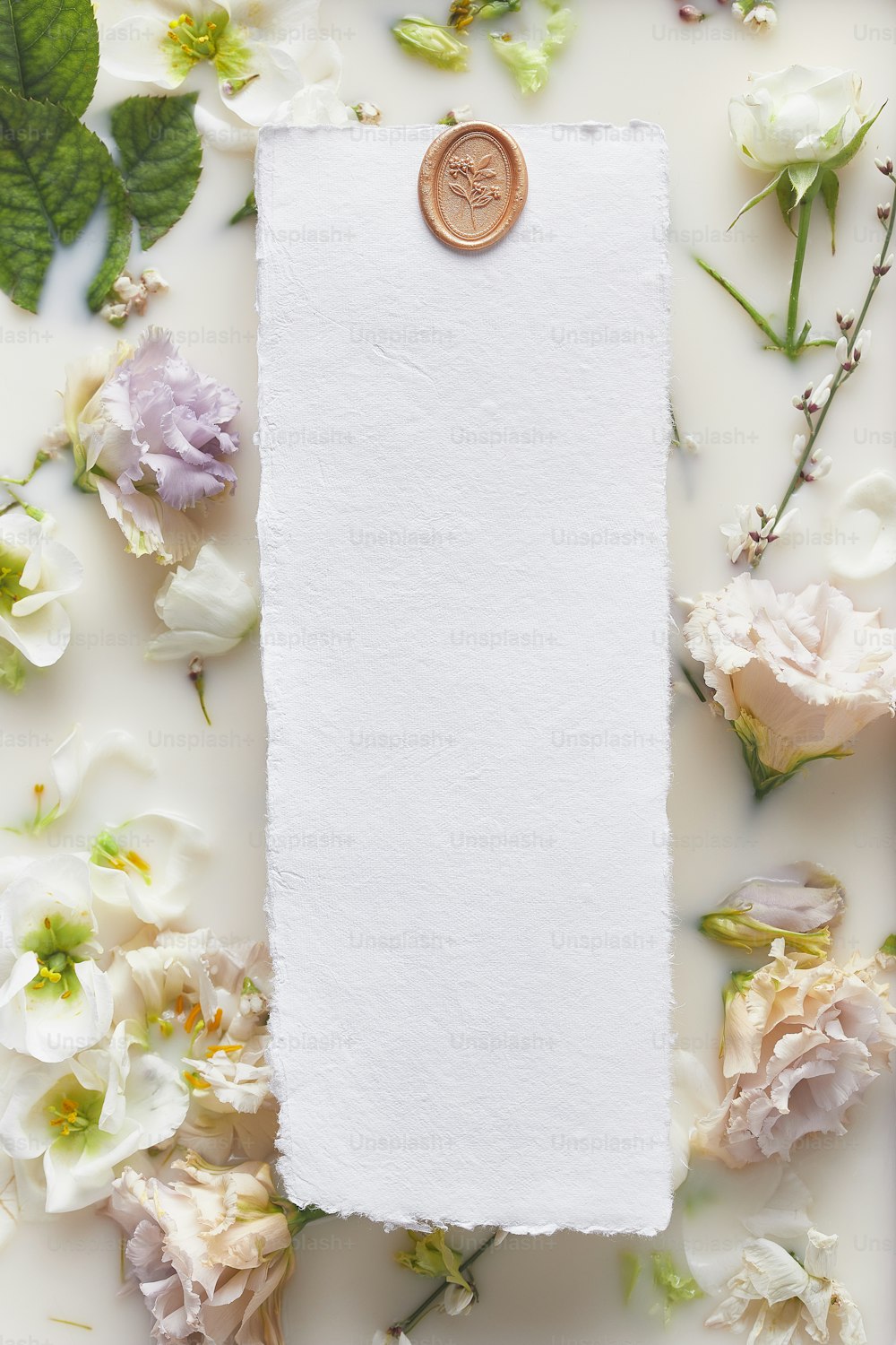 a white sheet of paper with a penny on top of it