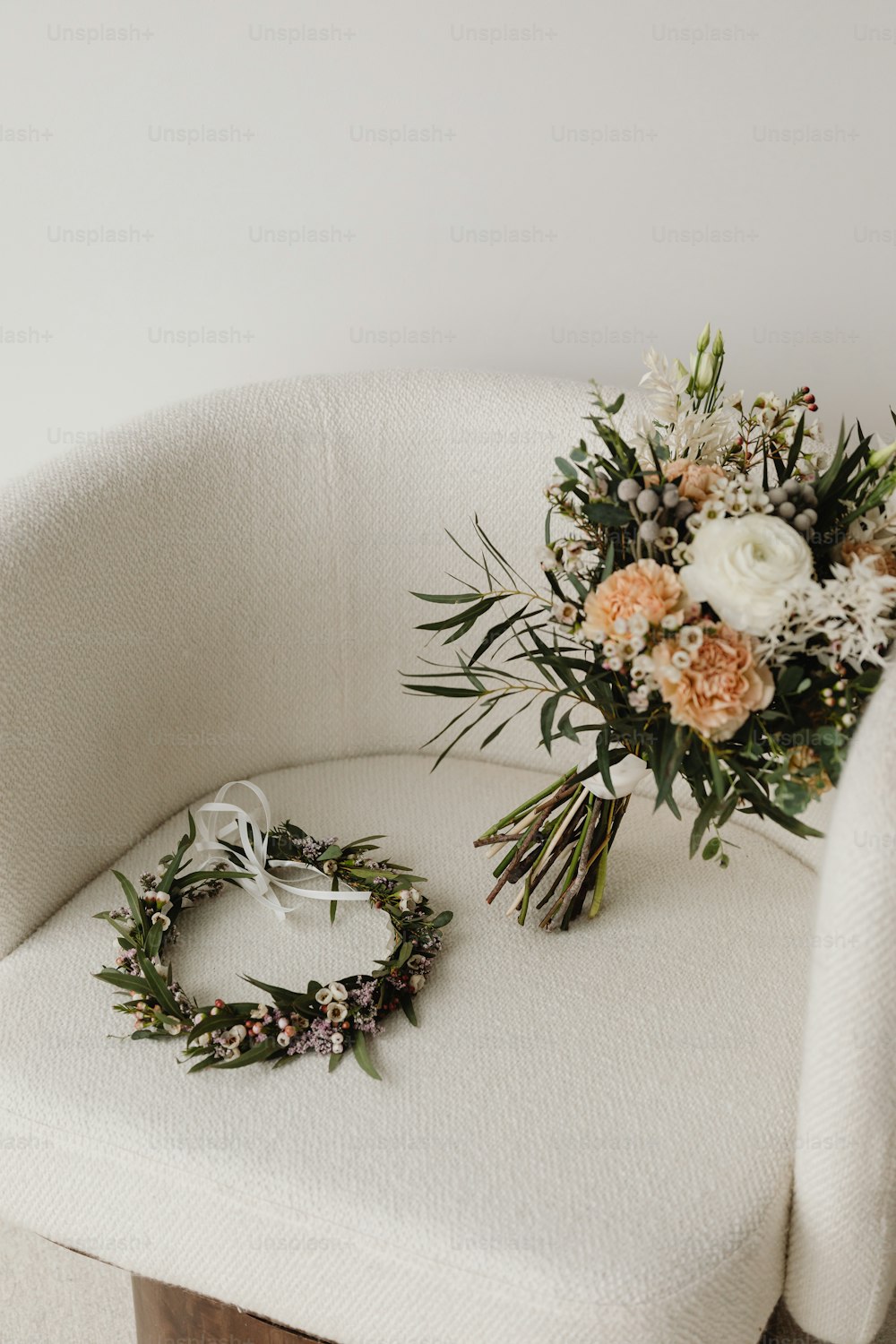 a bouquet of flowers sitting on top of a white chair