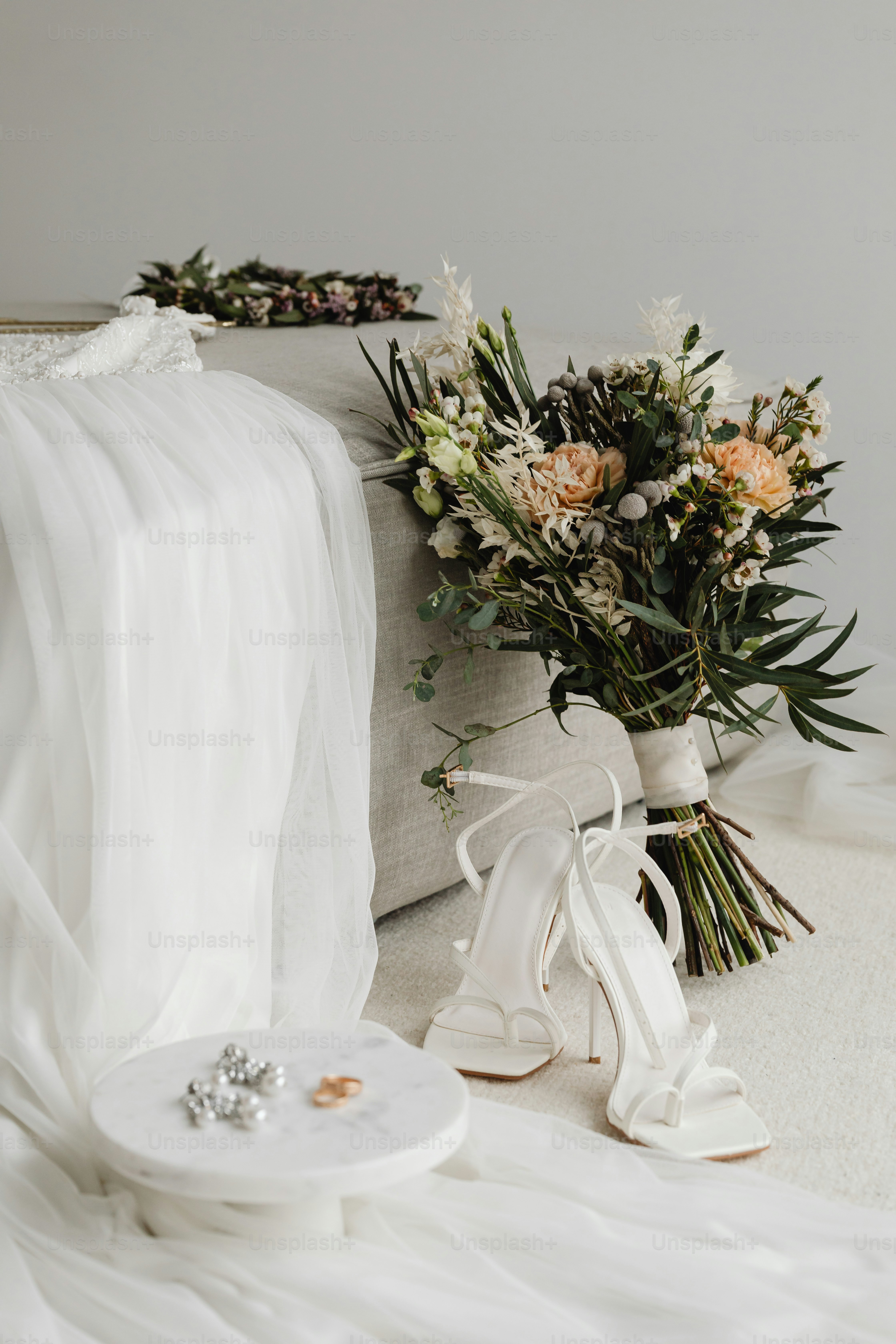 a bouquet of flowers sitting next to a pair of shoes