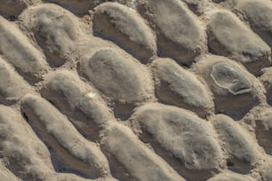 a close up of a rock wall made of sand