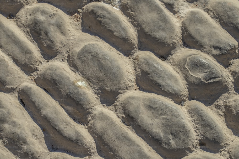 a close up of a rock wall made of sand