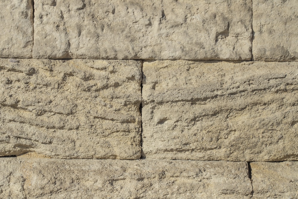 a close up of a wall made of rocks