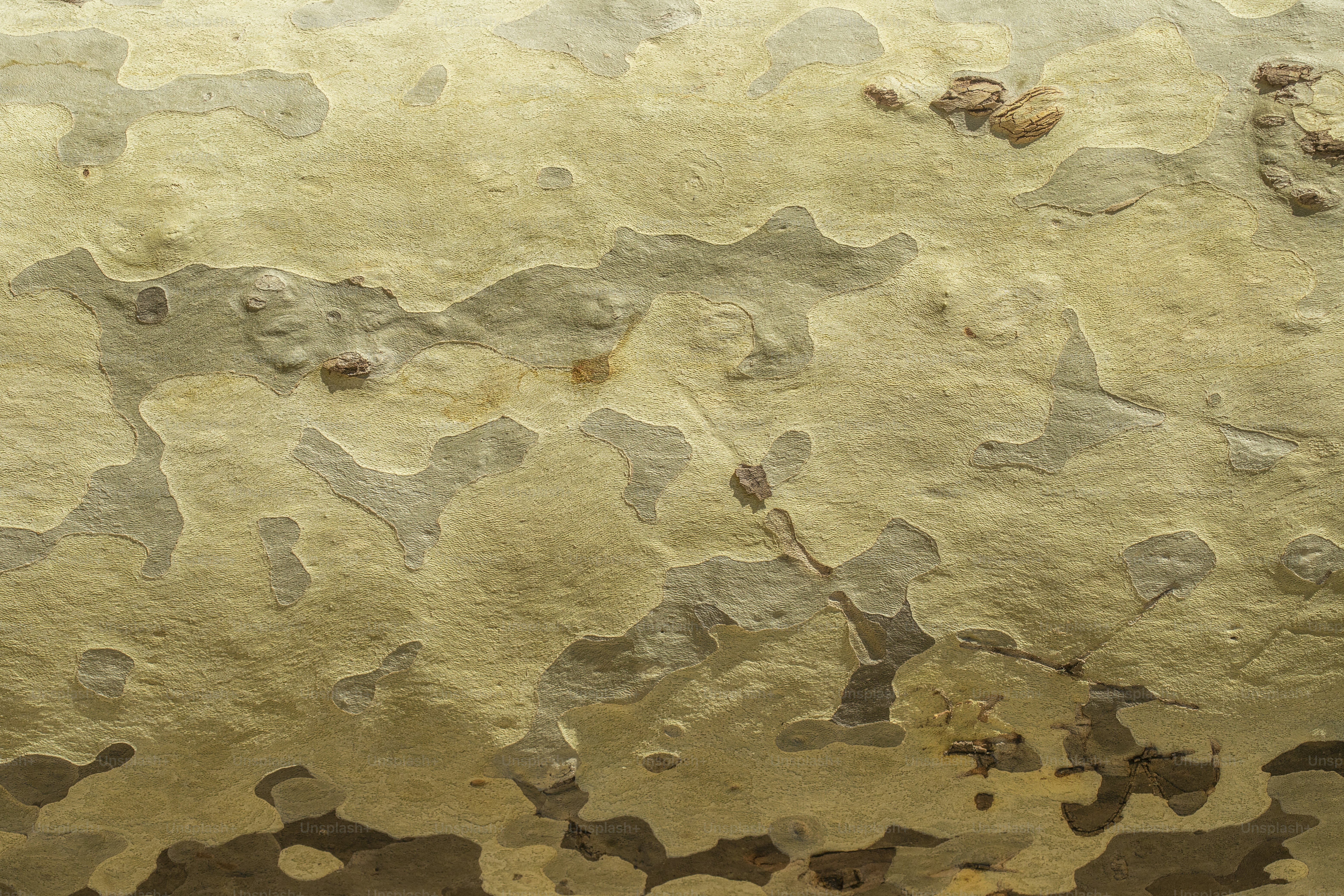 a close up of a wall with peeling paint