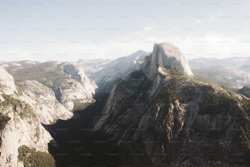 a view of a mountain range from the top of a mountain