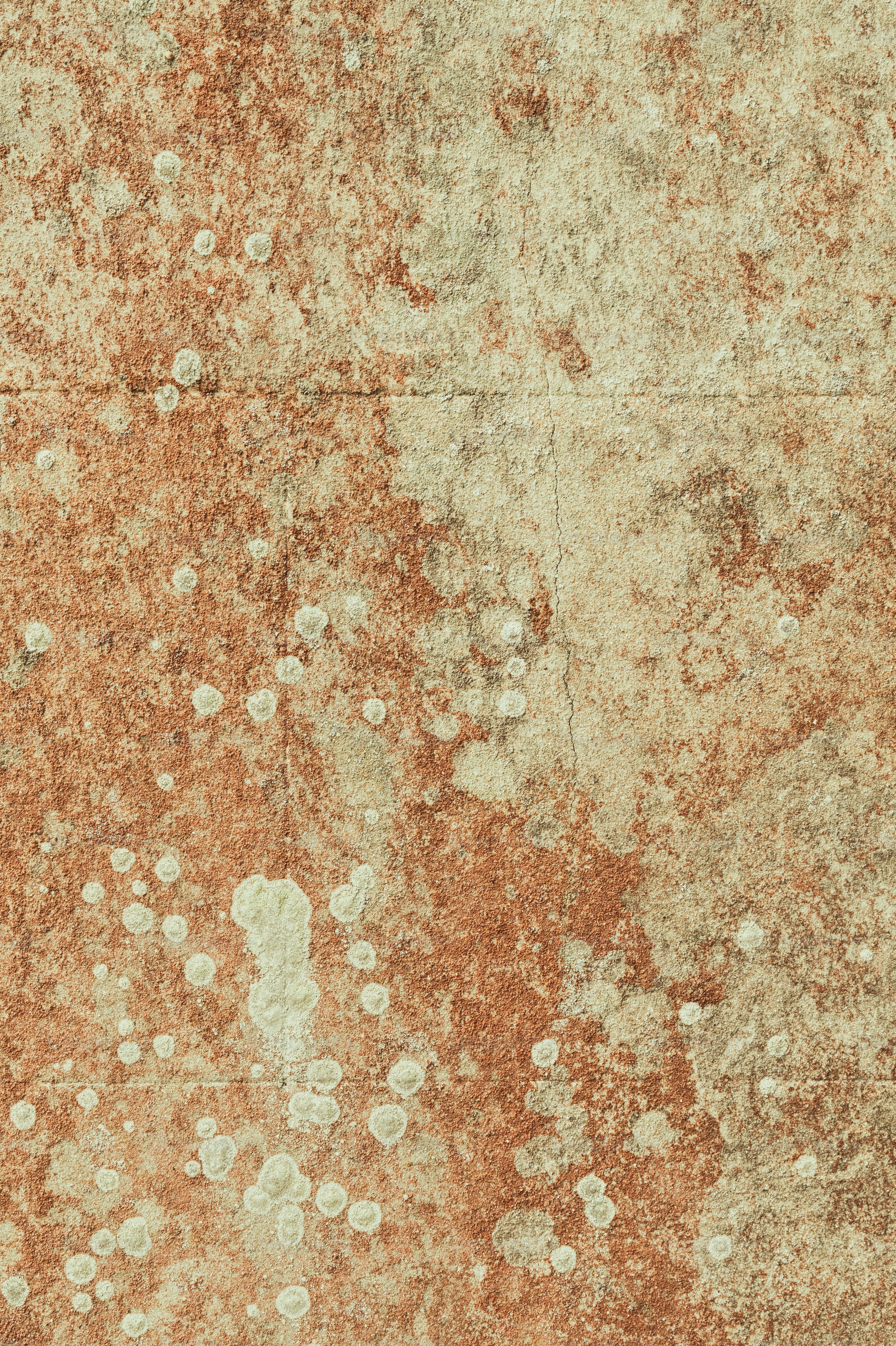 a rusted wall with white dots on it