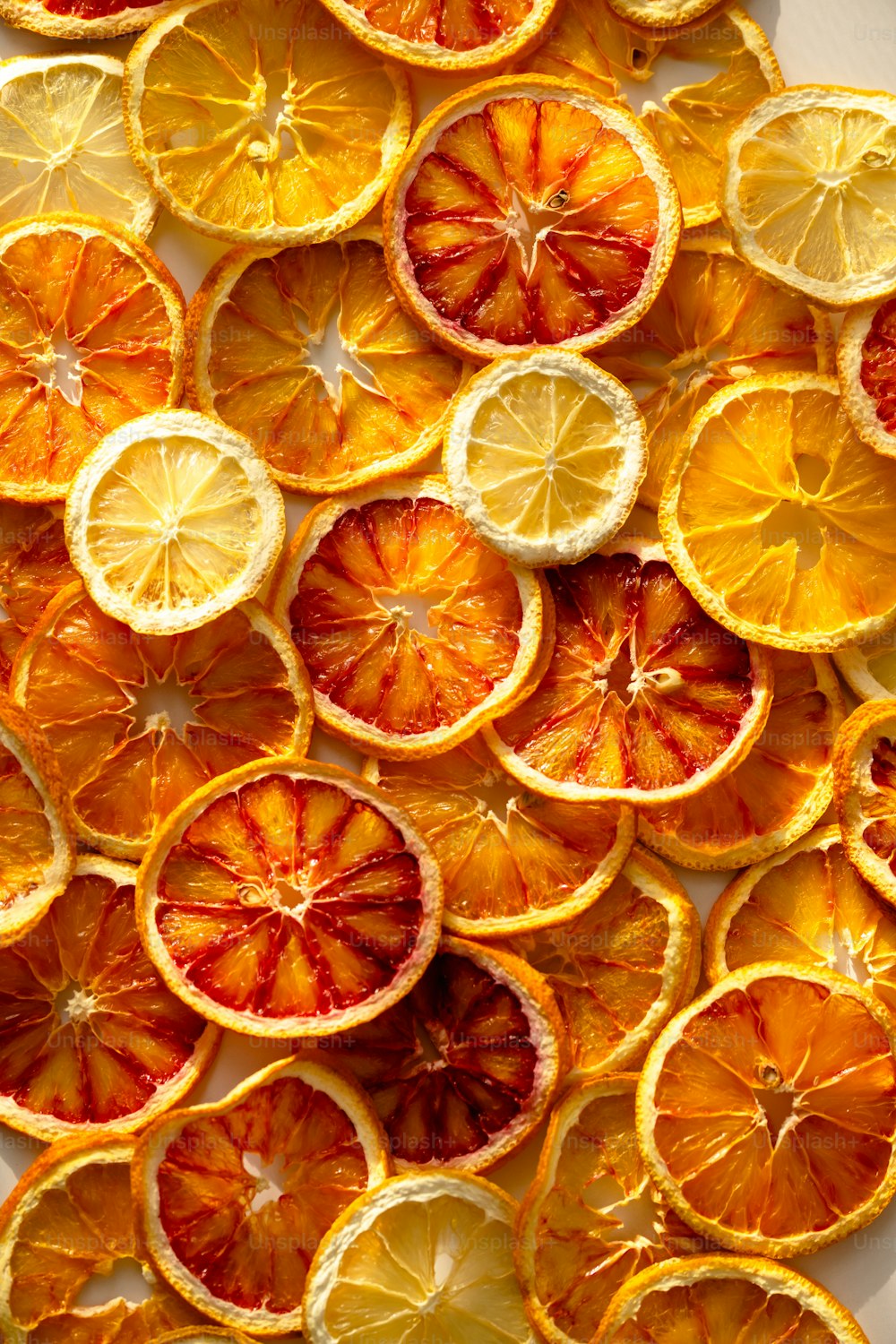 a bunch of oranges that are cut in half