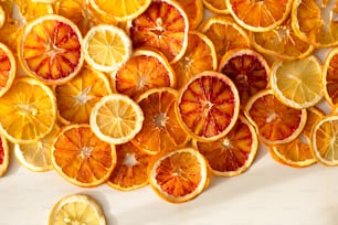 a bunch of oranges that are cut in half