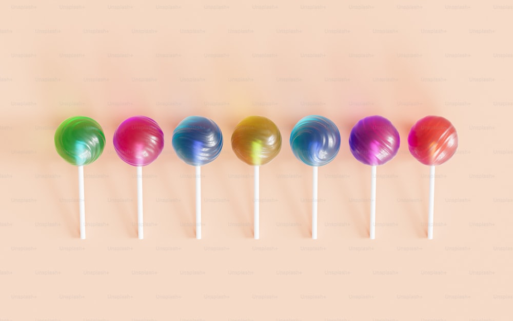 a row of multicolored lollipops sitting on top of each other