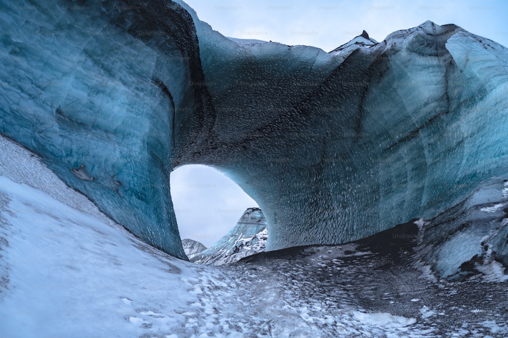 a large iceberg with a hole in the middle of it