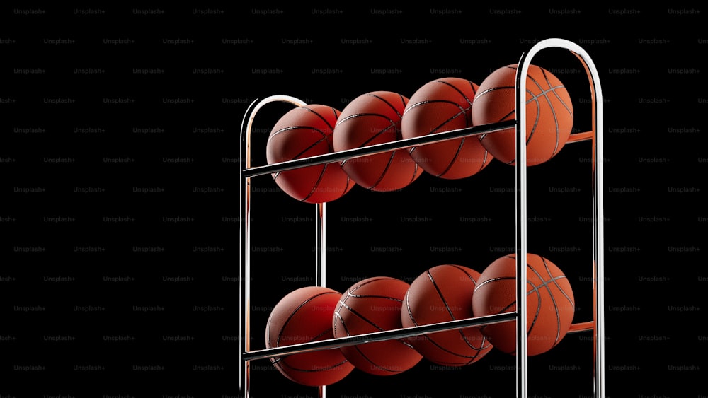 a rack of basketballs on a black background
