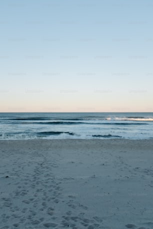 a view of the ocean from a sandy beach