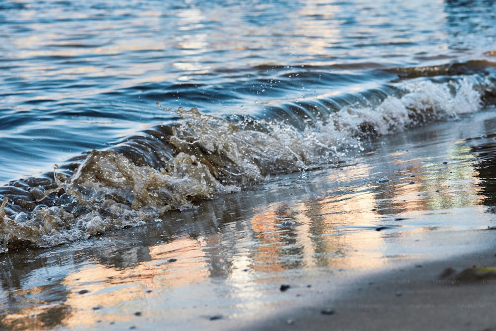 a close up of a wave coming in to the shore