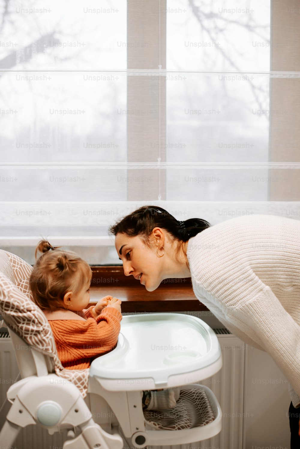 a woman and a child in a bathtub