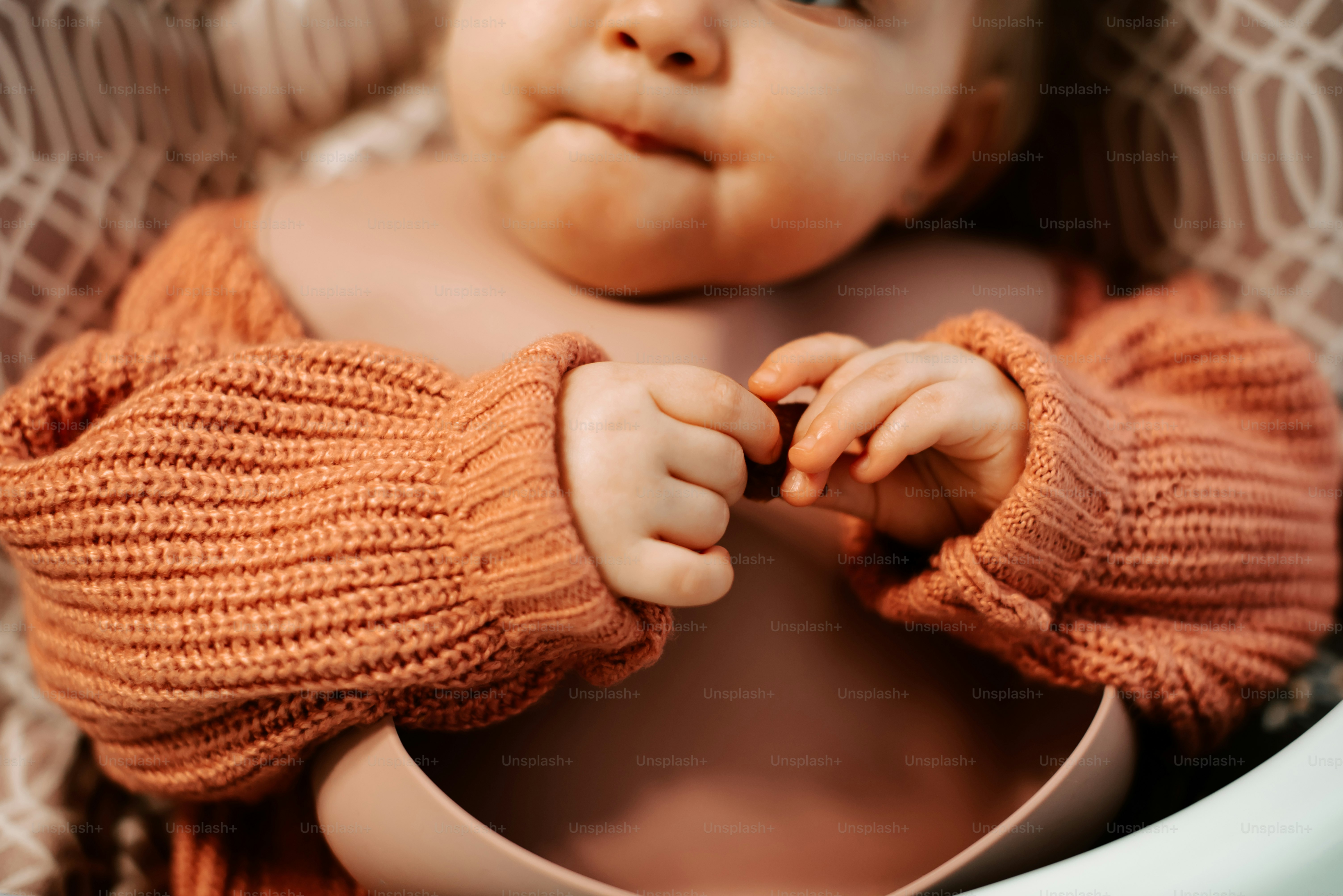 a close up of a baby in a basket