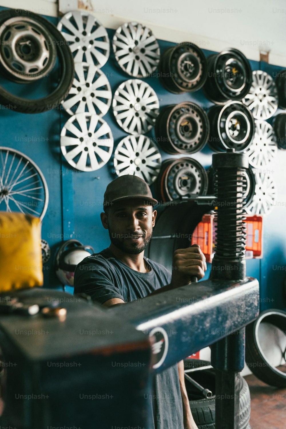 a man working on a machine in a shop