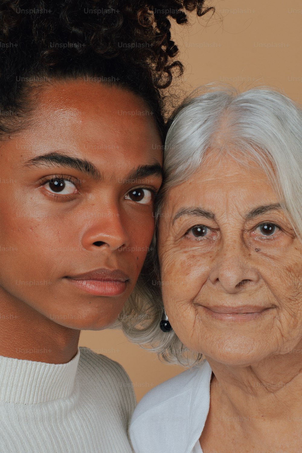 an older woman and a younger woman pose for a picture