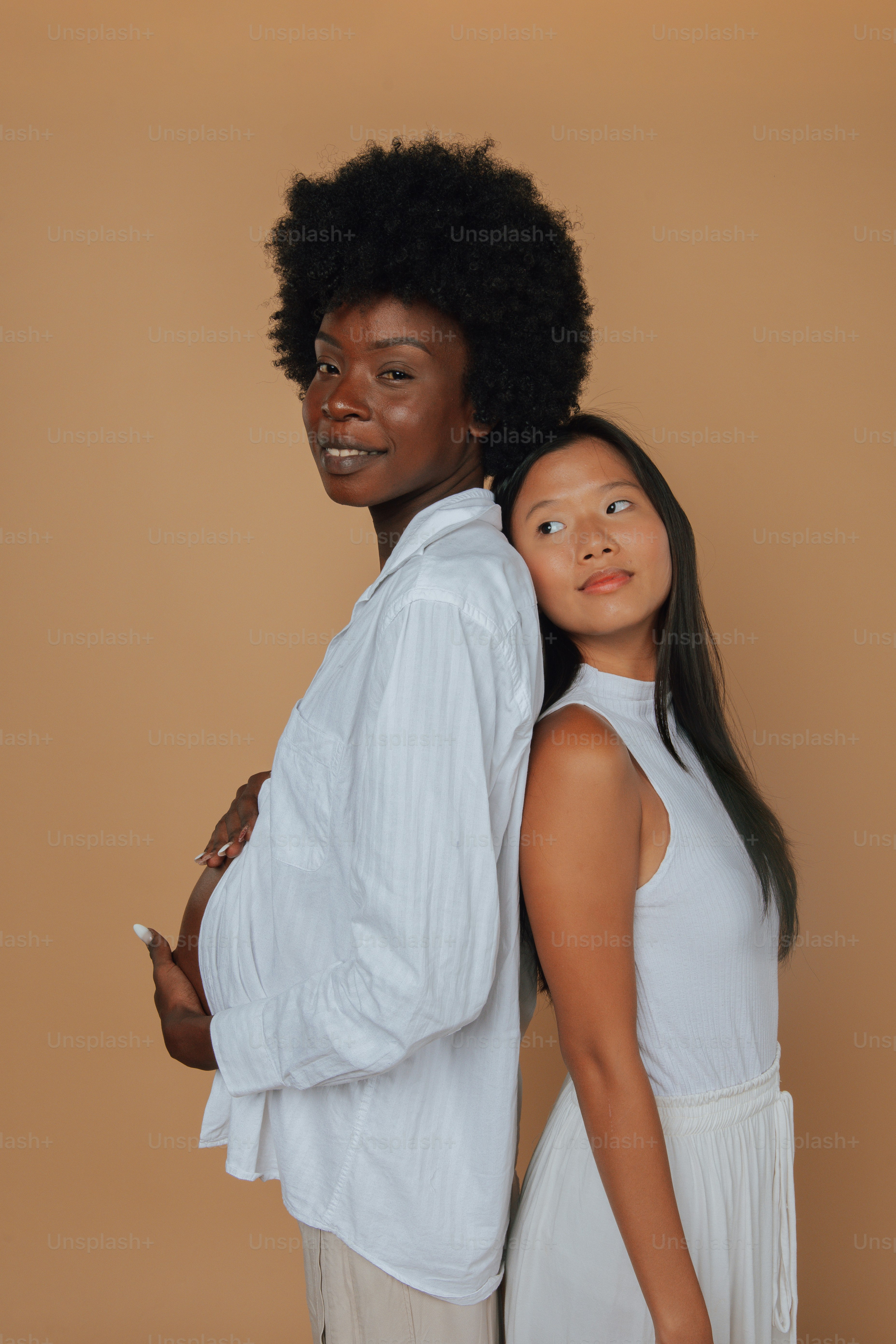 a couple of people standing next to each other