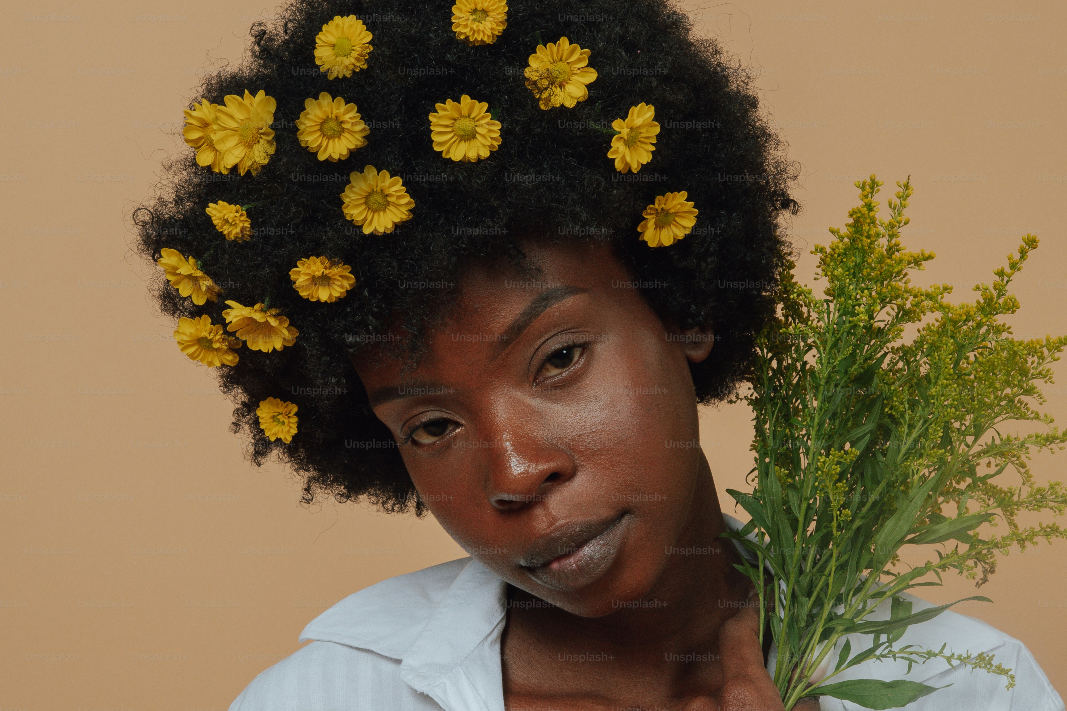 A woman with a bunch of flowers on her head photo – Confident Image on ...
