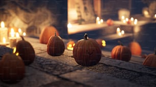 a group of pumpkins sitting on top of a sidewalk