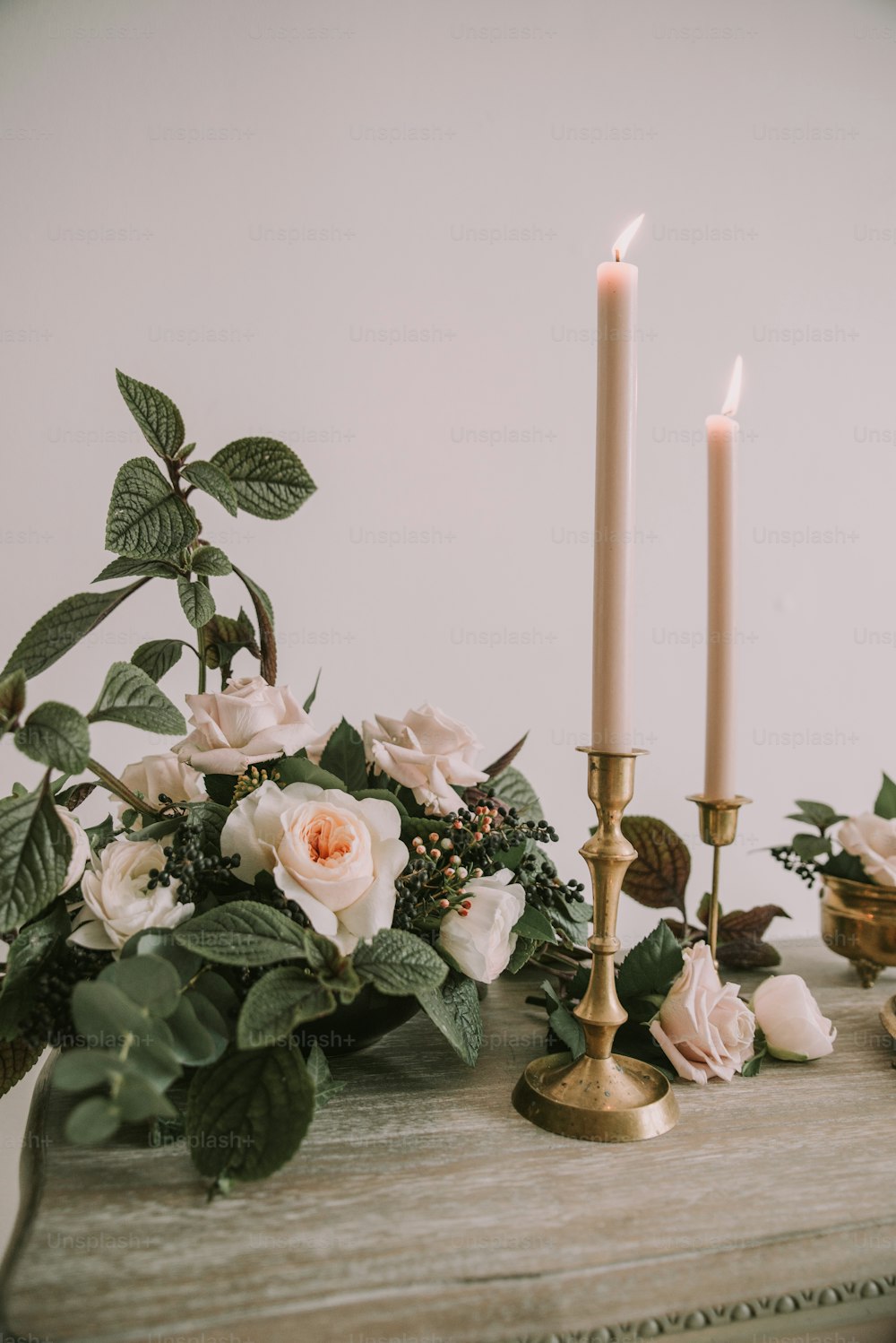 a couple of candles sitting on top of a table