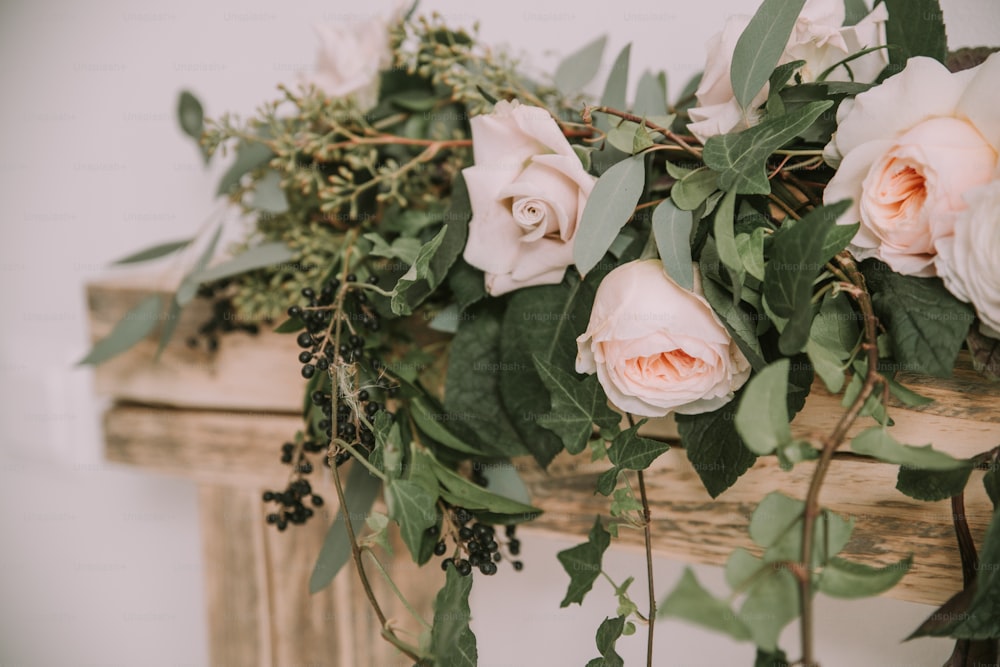 a bunch of flowers that are on a shelf