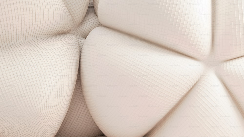 a close up of a white couch cushion