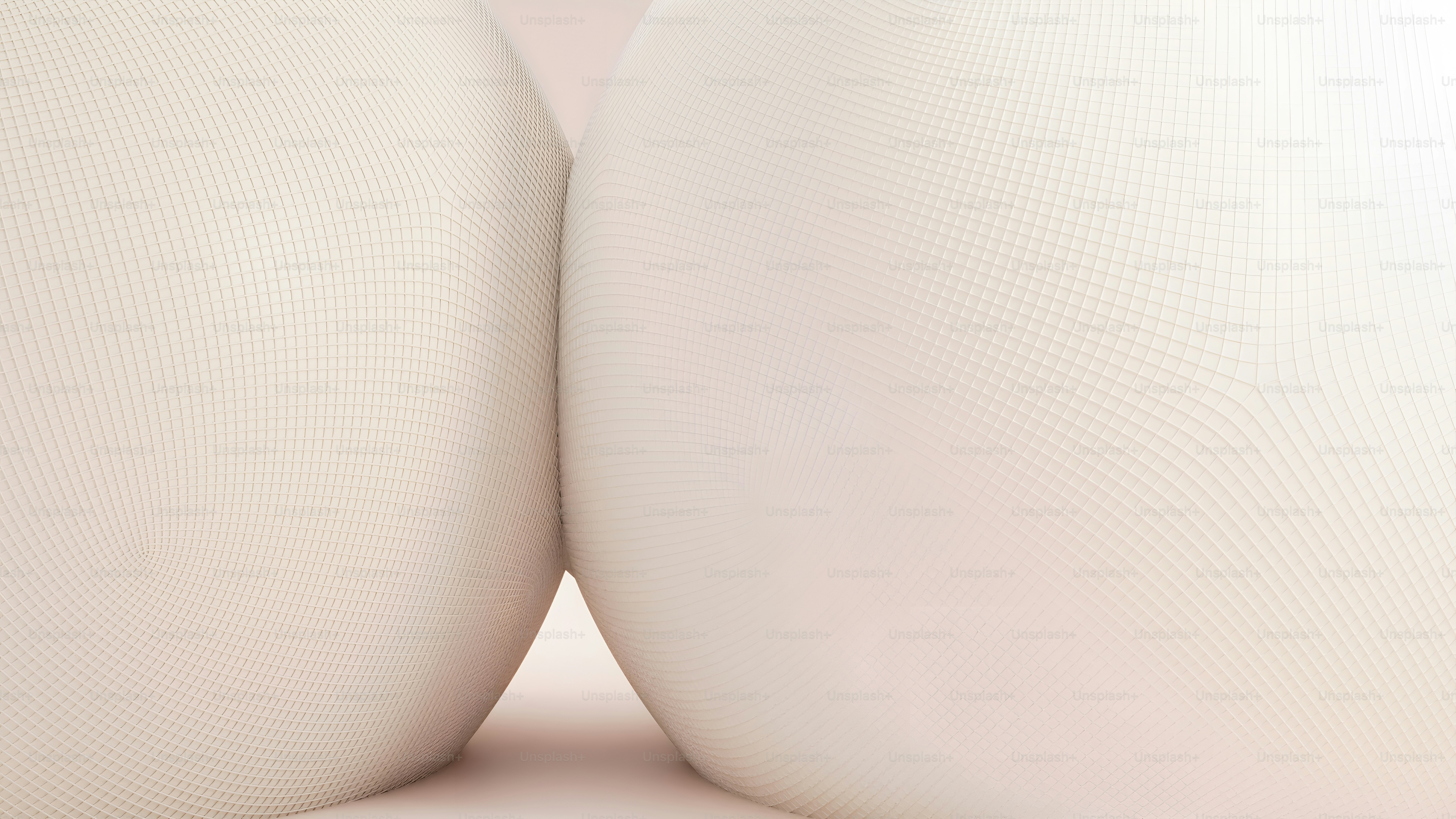 two white vases sitting next to each other