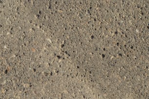 a close up of a dirt surface with small rocks