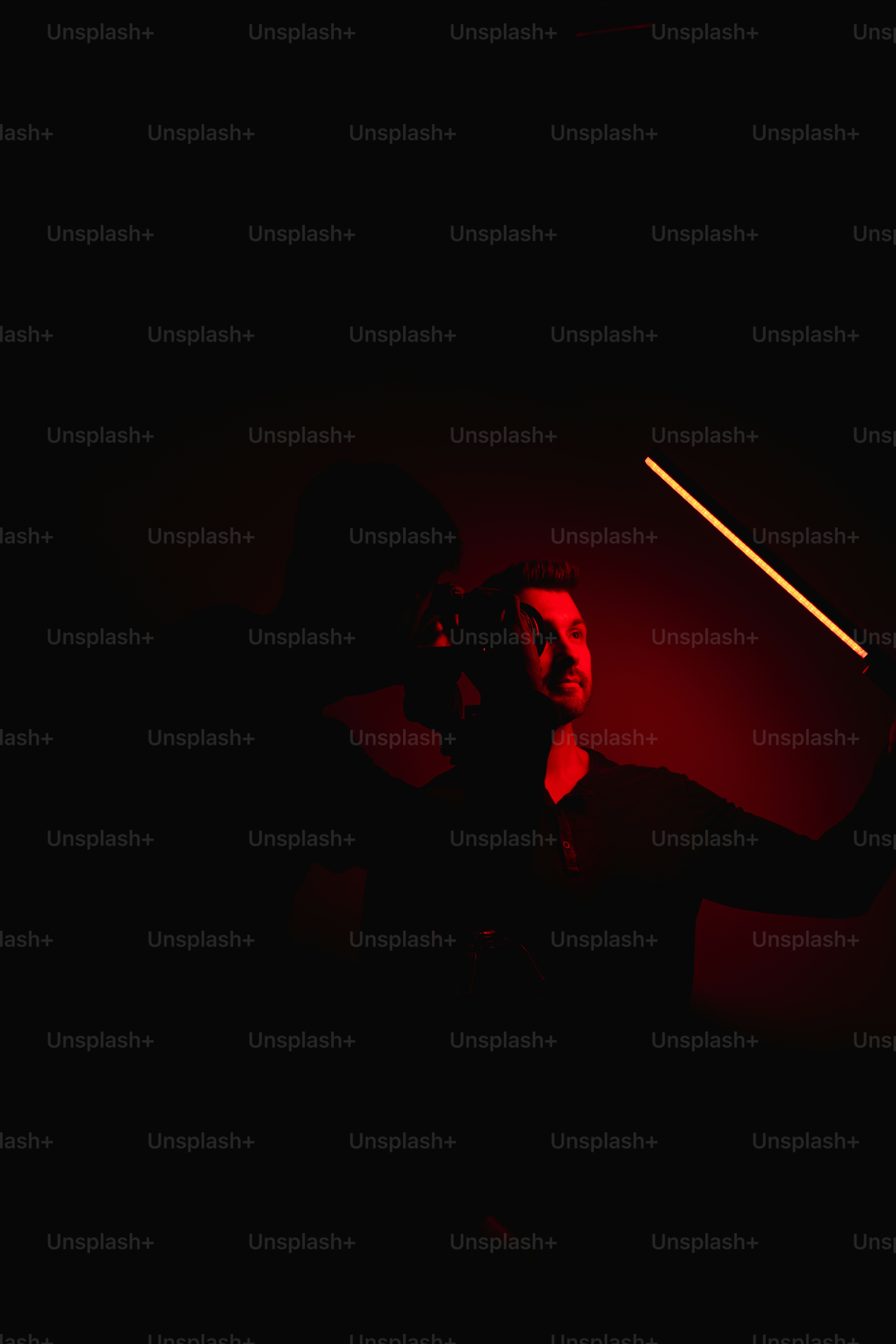 A woman holding a flashlight in the dark photo – Shadow woman Image on ...