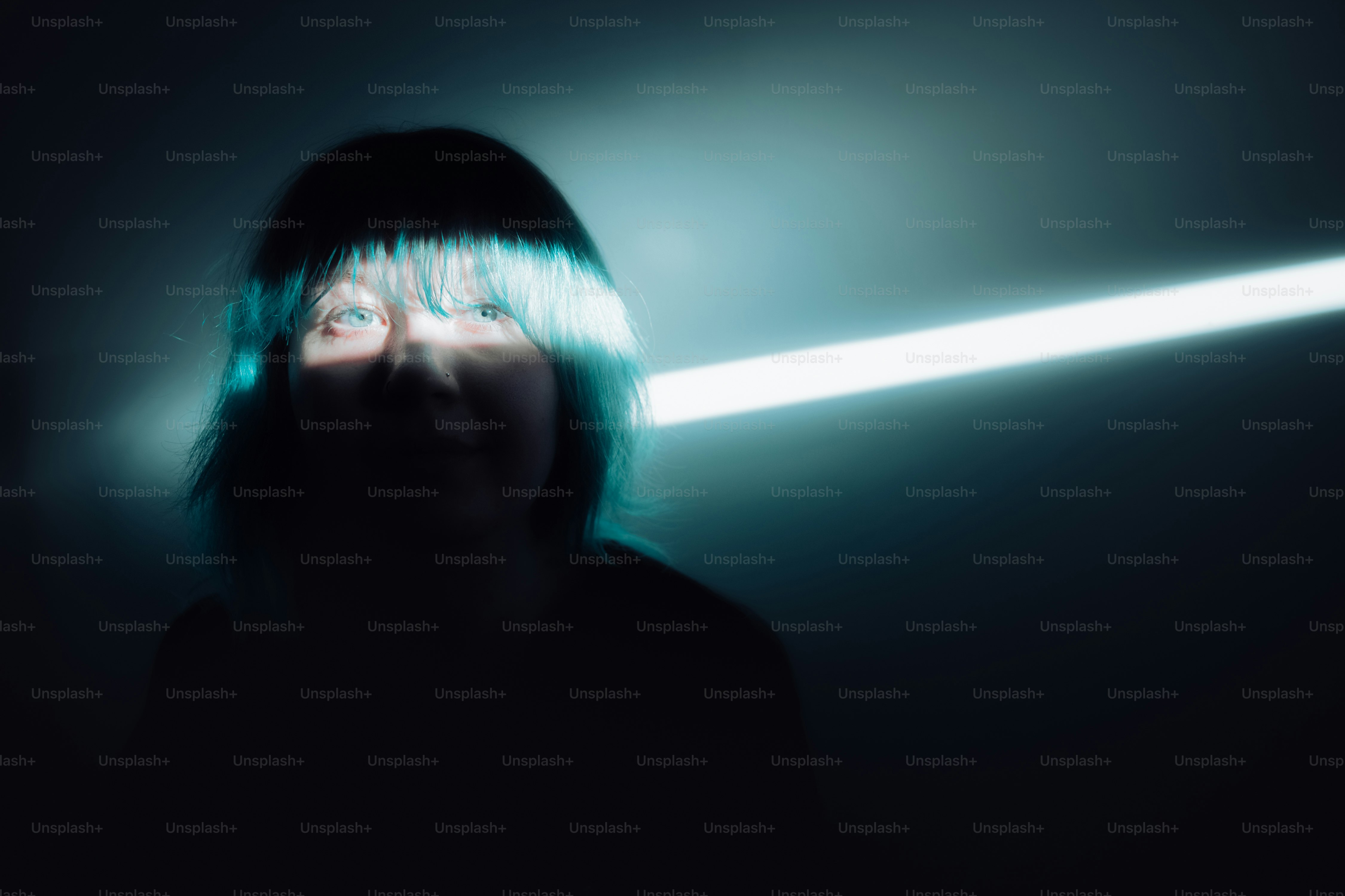 A woman holding a flashlight in the dark photo – Shadow woman Image on ...