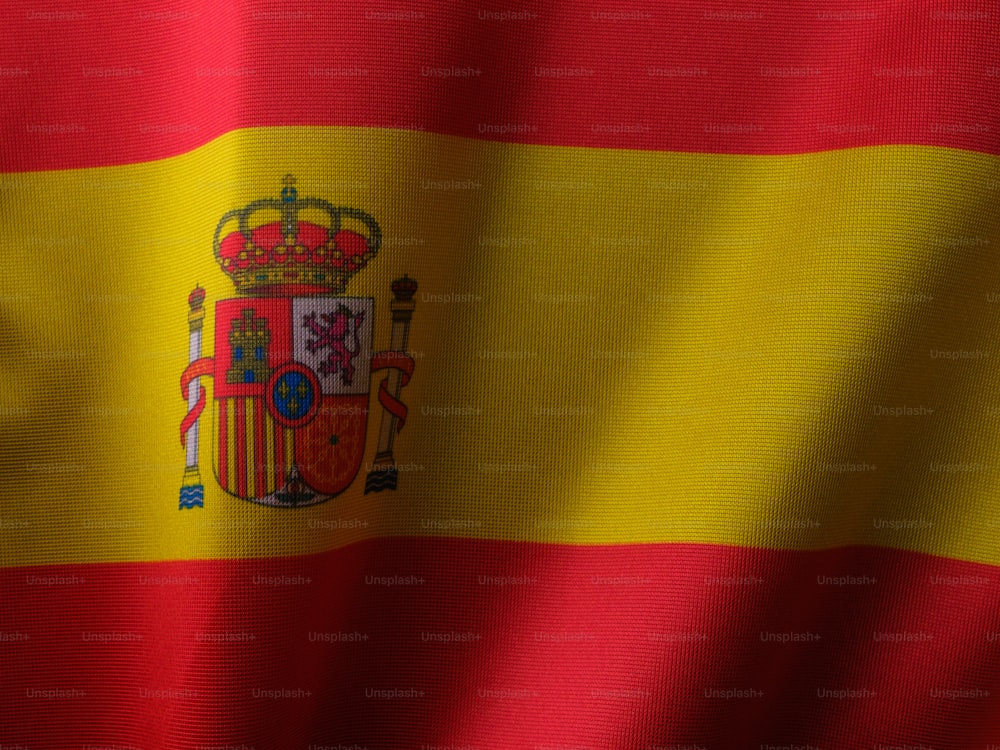 the flag of spain is waving in the wind