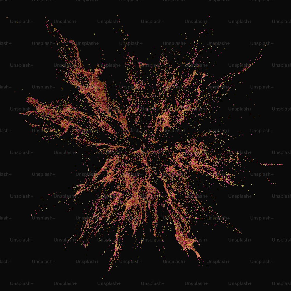 an orange and red splattered object on a black background