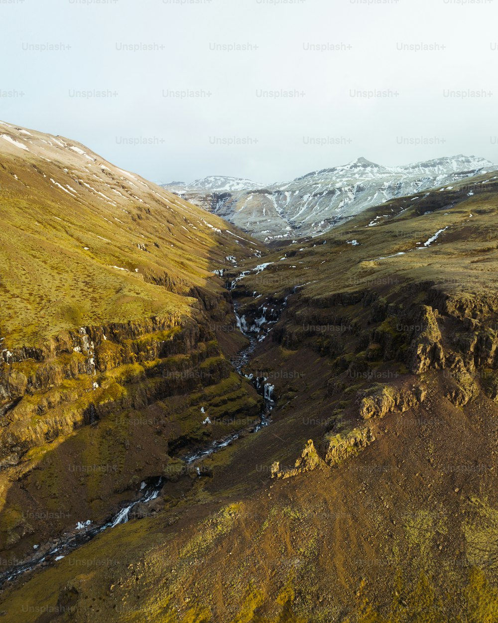 an aerial view of a valley in the mountains
