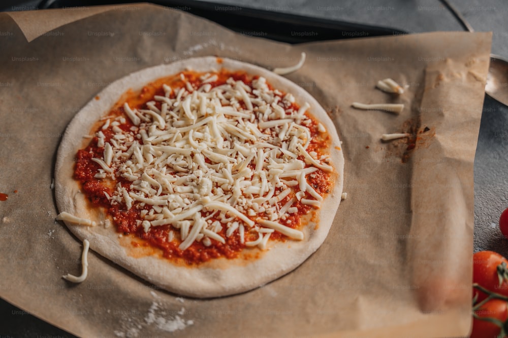 a pizza sitting on top of a piece of wax paper