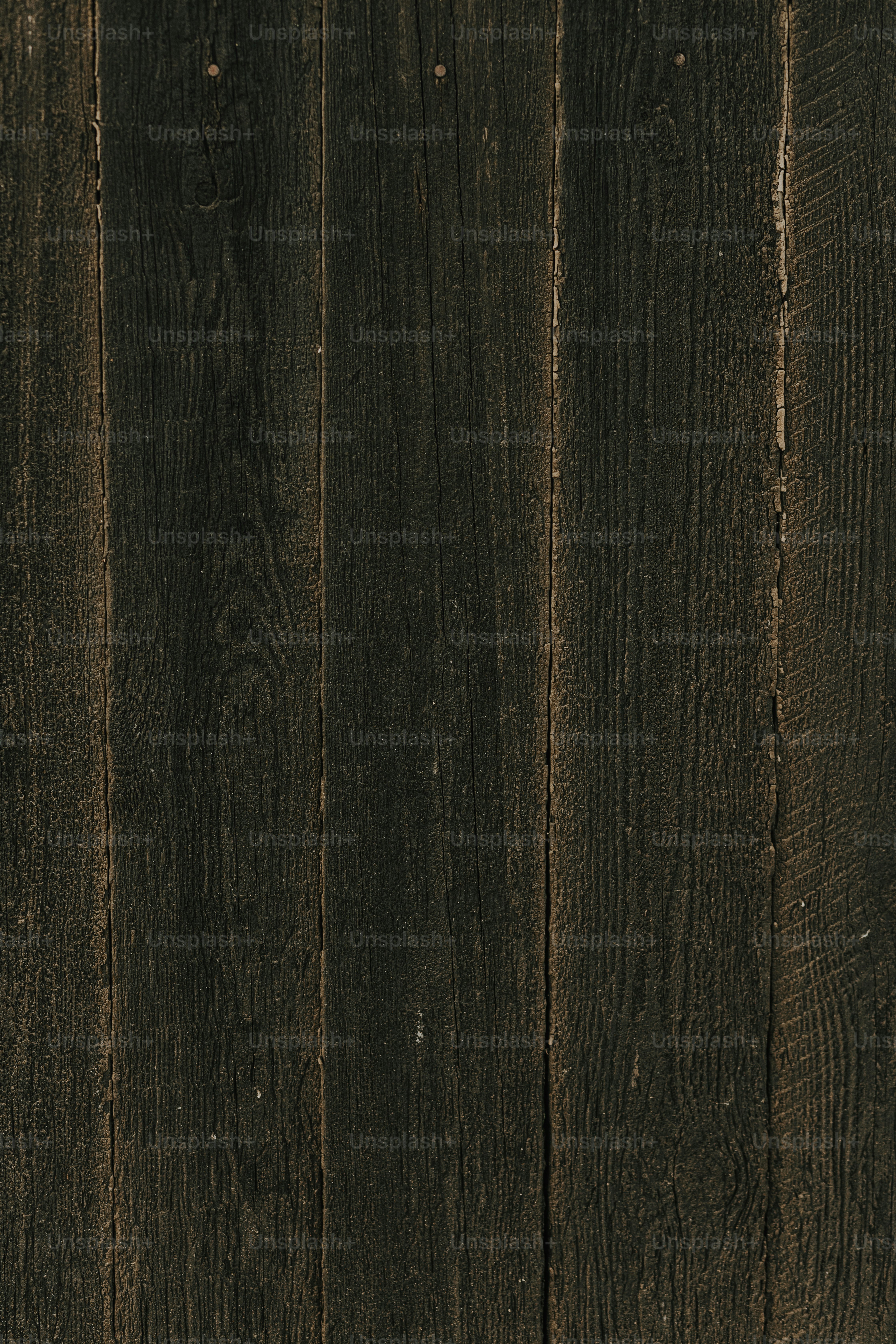a close up of a wooden wall with a clock on it
