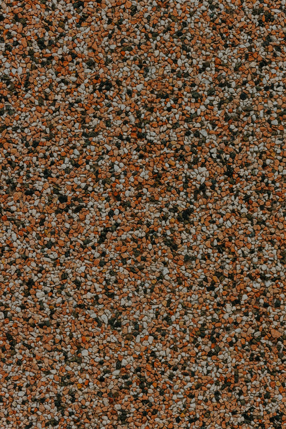 a close up of an orange and black speckled surface
