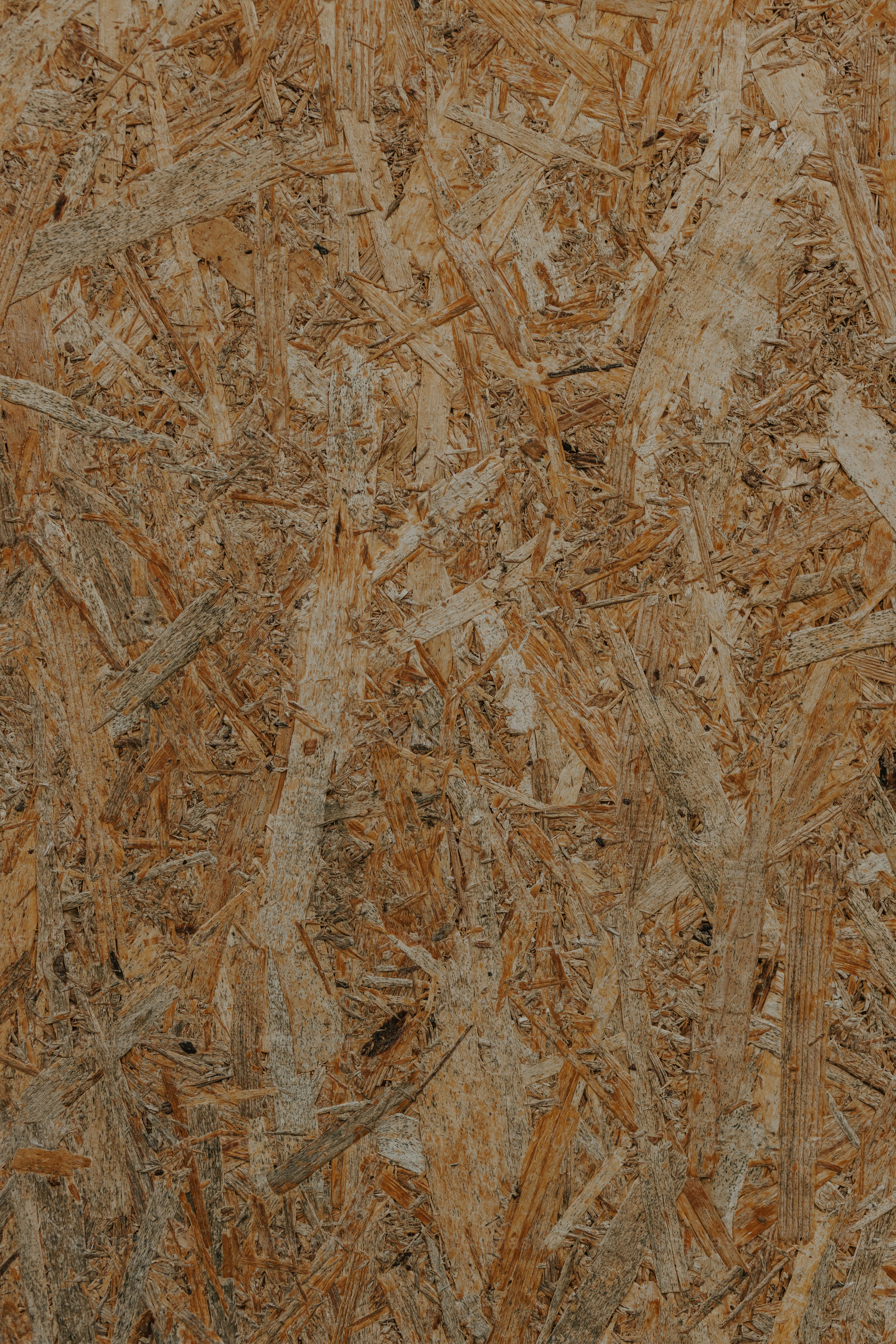 a close up of a wooden floor with a brown background