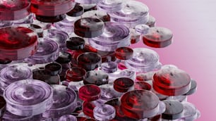 a pile of red and purple jars sitting on top of each other