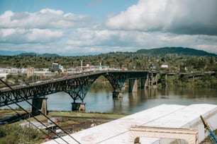 a bridge over a river with a train on it