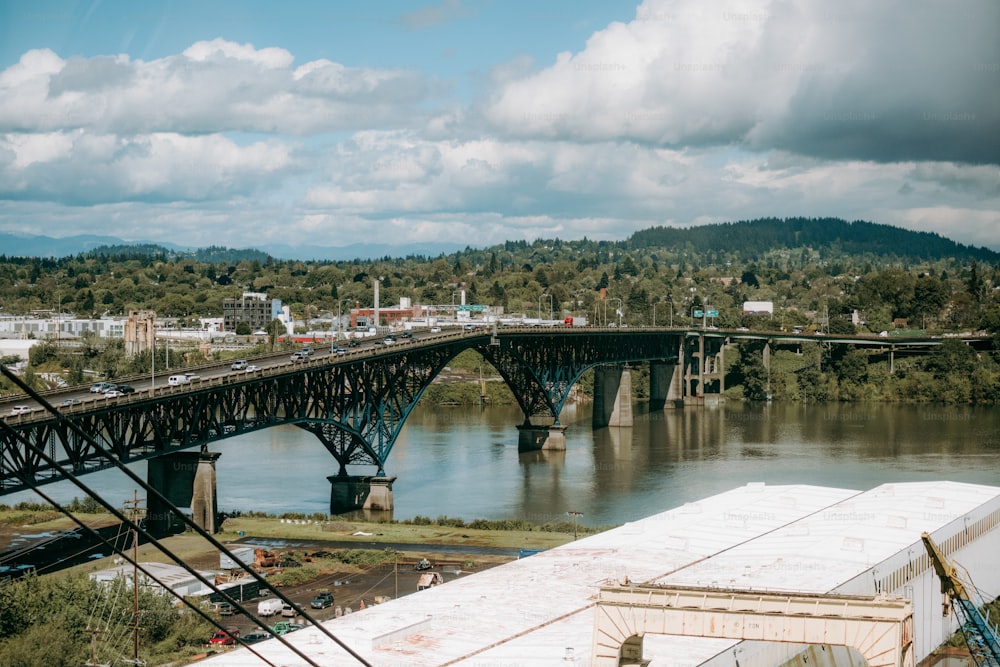 a bridge over a river with a train on it