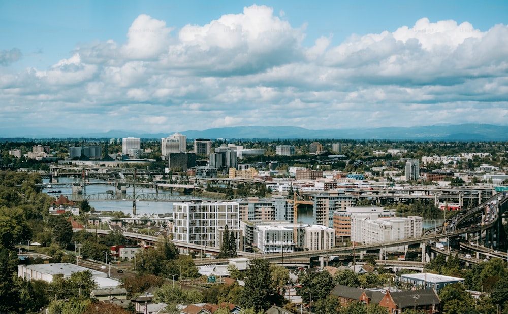 a view of a city with a bridge in the foreground