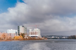 a large body of water with a bridge in the background