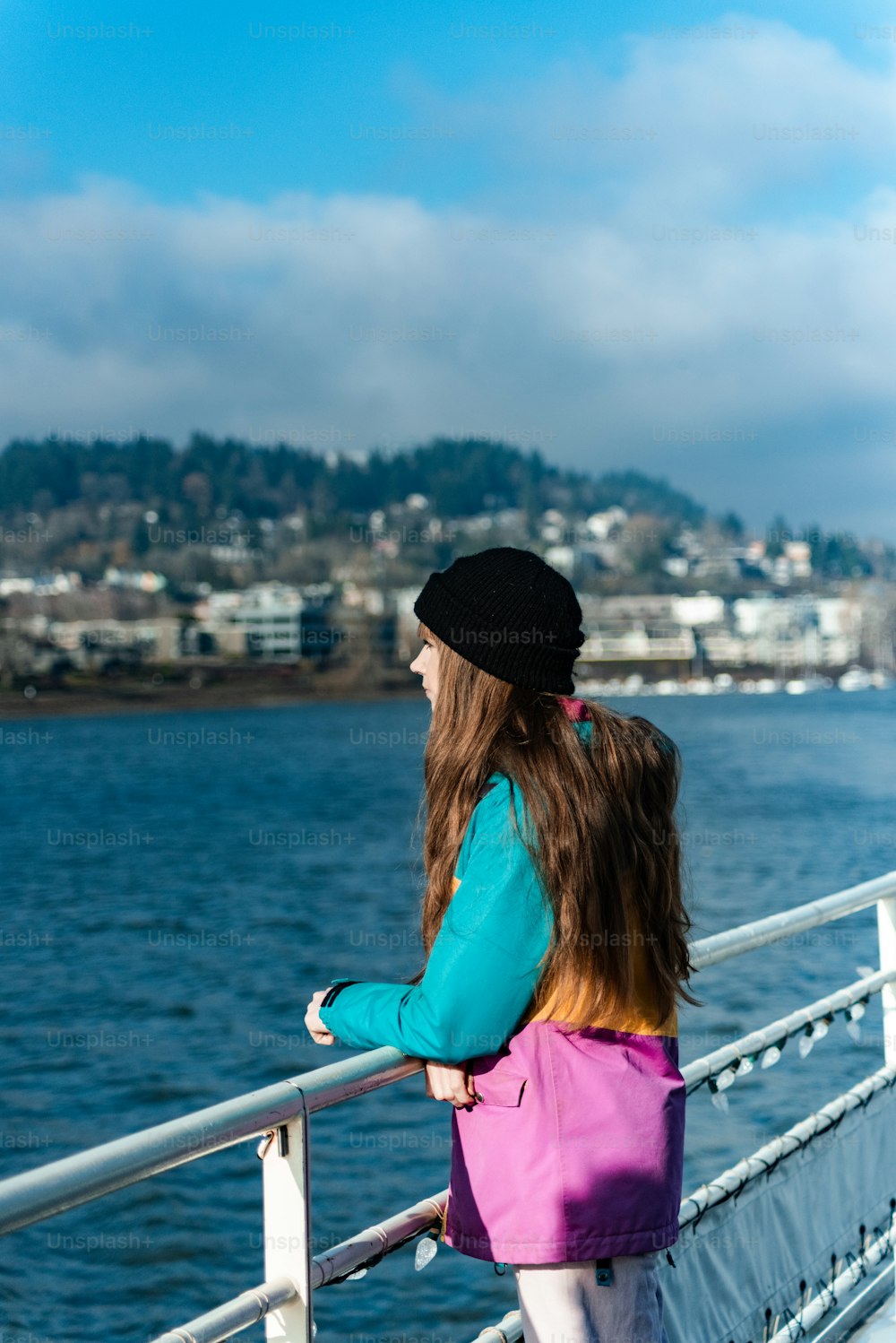 two young girls looking out over a body of water