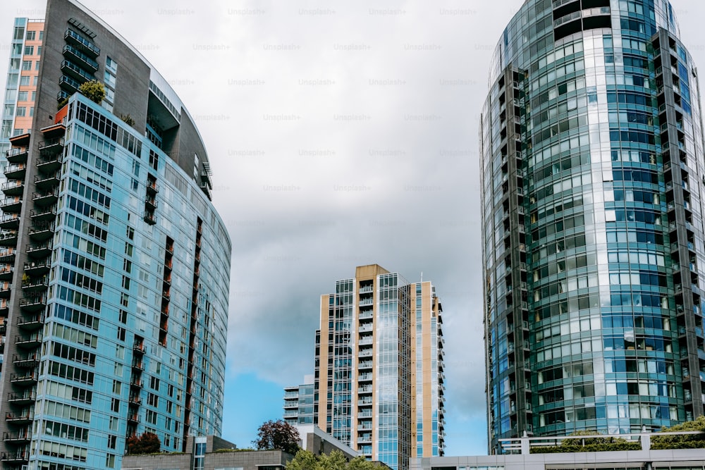 a couple of tall buildings sitting next to each other