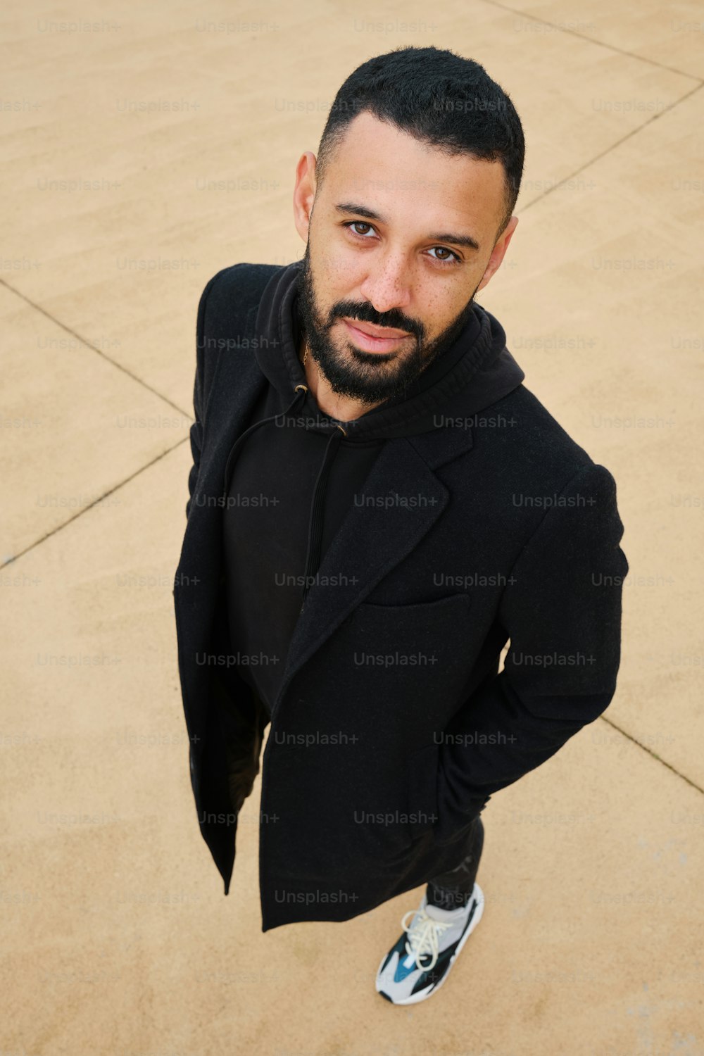 a man with a beard and a black jacket